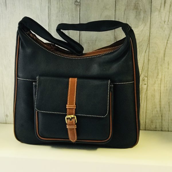 navy leather bag with tan trim