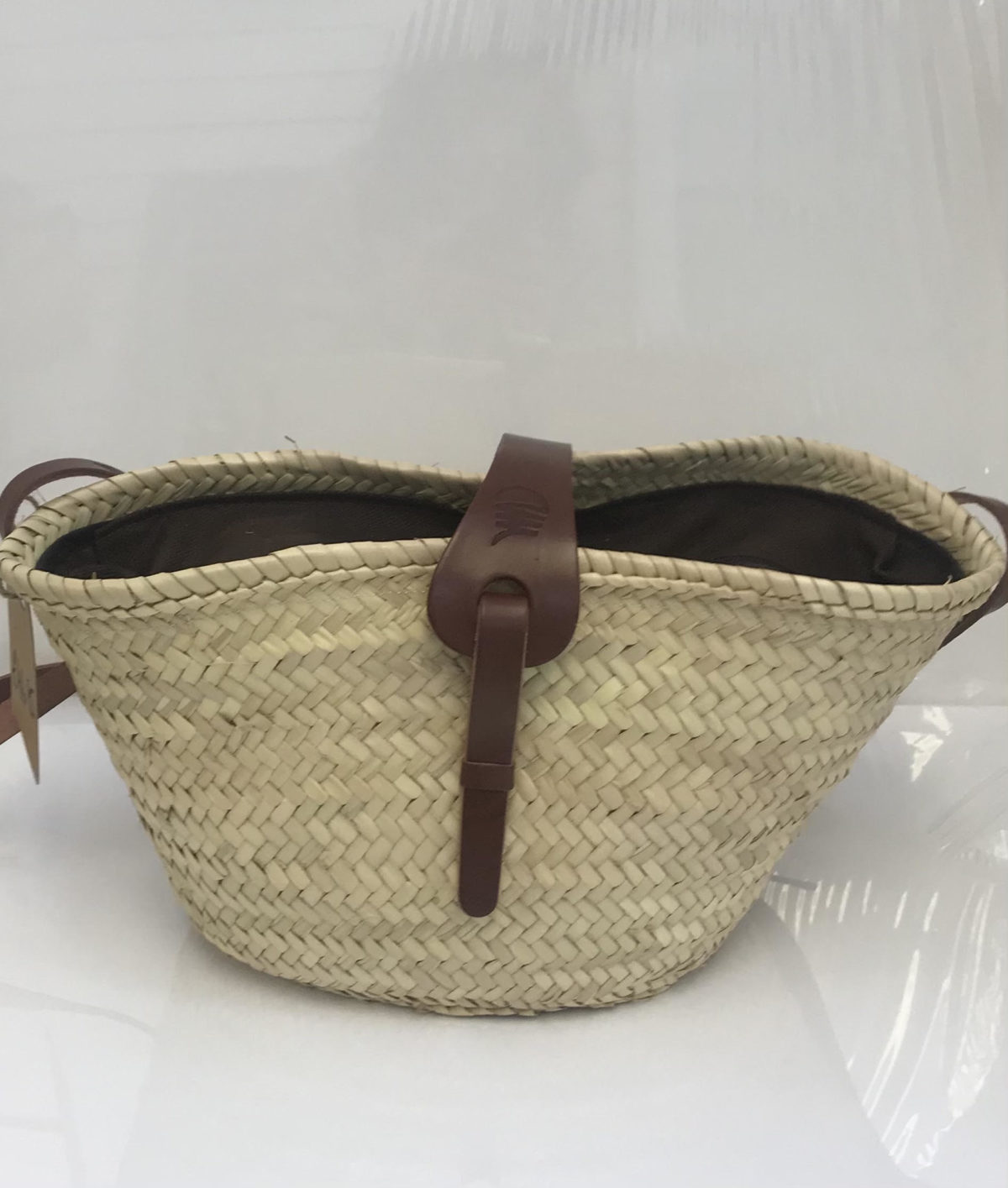woven crossbody bag with leather strap and closure