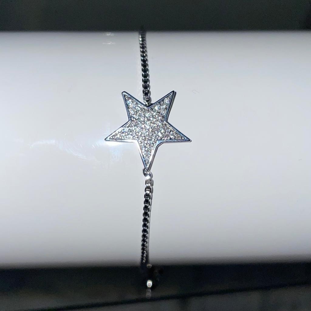 Silver bracelet costume jewellery with large diamante star and adjustable wrist closing